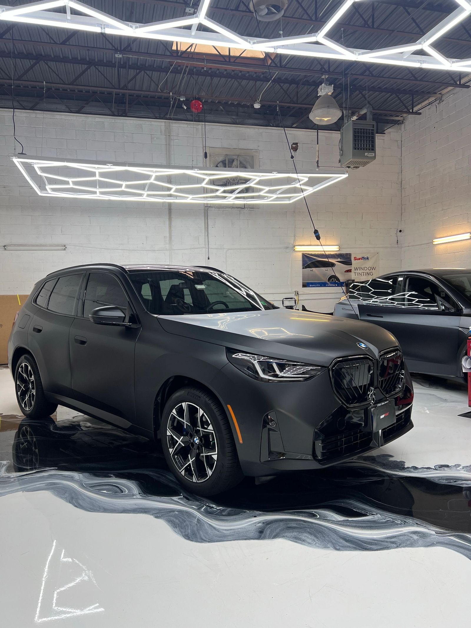 Matte black BMW SUV with full body PPF