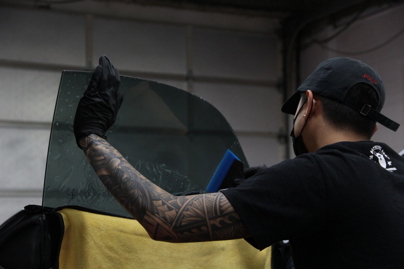 Porsche 911 interior covered to protect it from water during tint installation